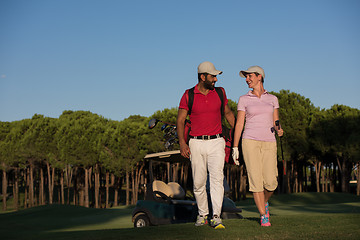 Image showing couple walking on golf course