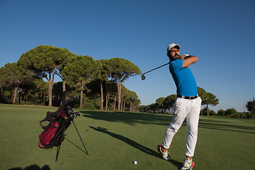 Image showing golf player hitting shot