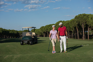 Image showing couple walking on golf course