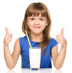 Image showing Cute little girl with a glass of milk