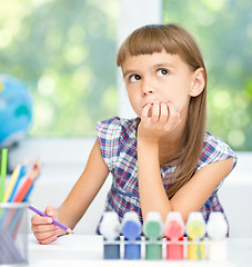 Image showing Little girl is daydreaming