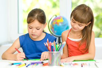 Image showing Little girls are drawing using pencils