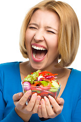 Image showing Young happy woman with salad