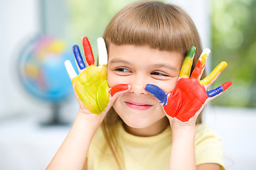 Image showing Portrait of a cute girl playing with paints