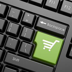 Image showing Green enter button with shopping cart on black keyboard, isolate