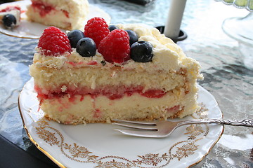 Image showing Piece of delicious gateau with different kind of berries