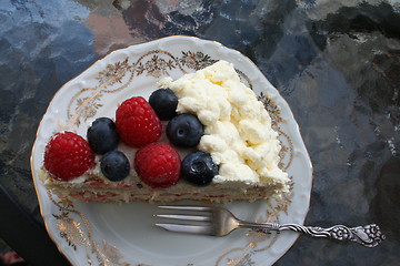 Image showing Piece of gateau with strawberry, raspberry and blueberry