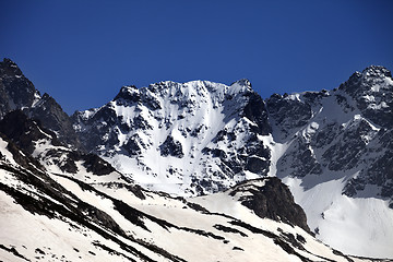 Image showing Snowy rocks at nice spring day