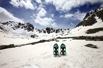 Image showing Snowshoes in snowy mountains