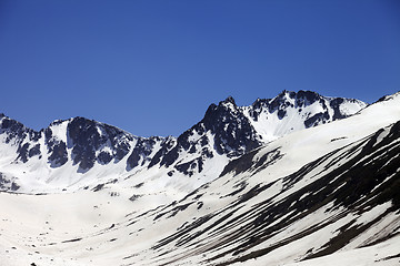 Image showing Snowy mountains at nice spring day