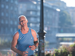 Image showing portrait of handsome senior jogging man