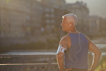 Image showing portrait of handsome senior jogging man