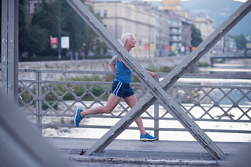 Image showing handsome senior man  jogging