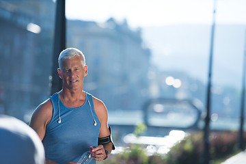 Image showing portrait of handsome senior jogging man