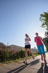 Image showing female friends jogging