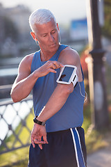 Image showing portrait of handsome senior jogging man