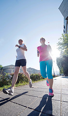 Image showing female friends jogging