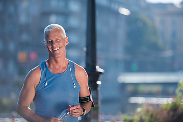 Image showing portrait of handsome senior jogging man