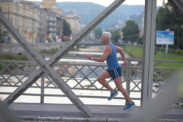 Image showing handsome senior man  jogging