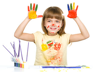 Image showing Portrait of a cute girl playing with paints