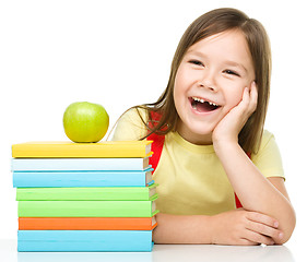 Image showing Little girl with her books