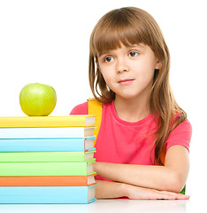 Image showing Little girl with her books