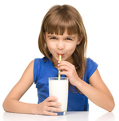 Image showing Cute little girl with a glass of milk