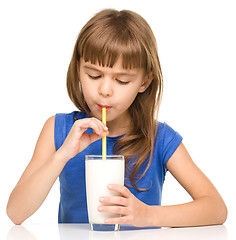 Image showing Cute little girl with a glass of milk