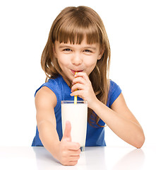 Image showing Cute little girl with a glass of milk