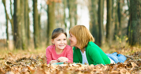 Image showing Mother is reading book with her daughter