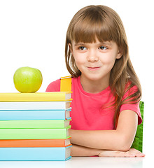 Image showing Little girl with her books