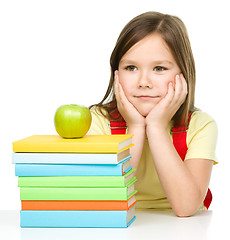 Image showing Little girl with her books