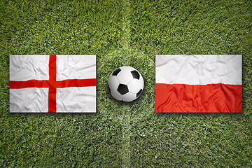 Image showing England vs. Poland flags on soccer field