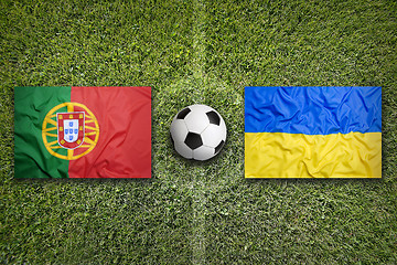 Image showing Portugal vs. Ukraine flags on soccer field