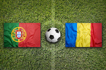 Image showing Portugal vs. Romania flags on soccer field