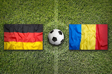 Image showing Germany vs. Romania flags on soccer field