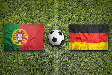 Image showing Portugal vs. Germany flags on soccer field