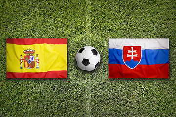 Image showing Spain vs. Slovakia flags on soccer field