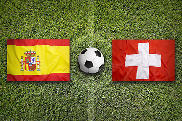 Image showing Spain vs. Switzerland flags on soccer field