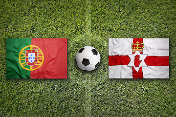 Image showing Portugal vs. Northern Ireland flags on soccer field
