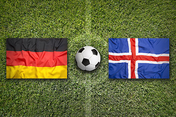 Image showing Germany vs. Iceland flags on soccer field