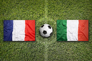 Image showing France vs. Italy flags on soccer field