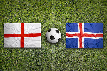 Image showing England vs. Iceland flags on soccer field