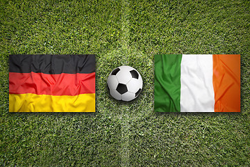 Image showing Germany vs. Ireland flags on soccer field