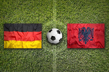 Image showing Germany vs. Albania flags on soccer field