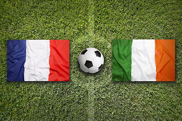 Image showing France vs. Ireland flags on soccer field