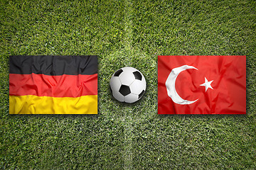 Image showing Germany vs. Turkey flags on soccer field