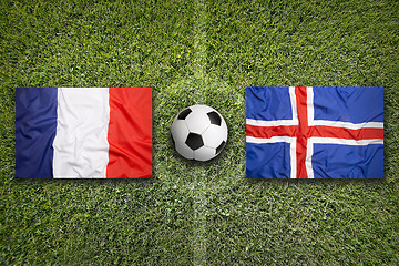 Image showing France vs. Iceland flags on soccer field