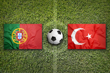 Image showing Portugal vs. Turkey flags on soccer field