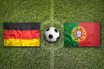 Image showing Germany vs. Portugal flags on soccer field